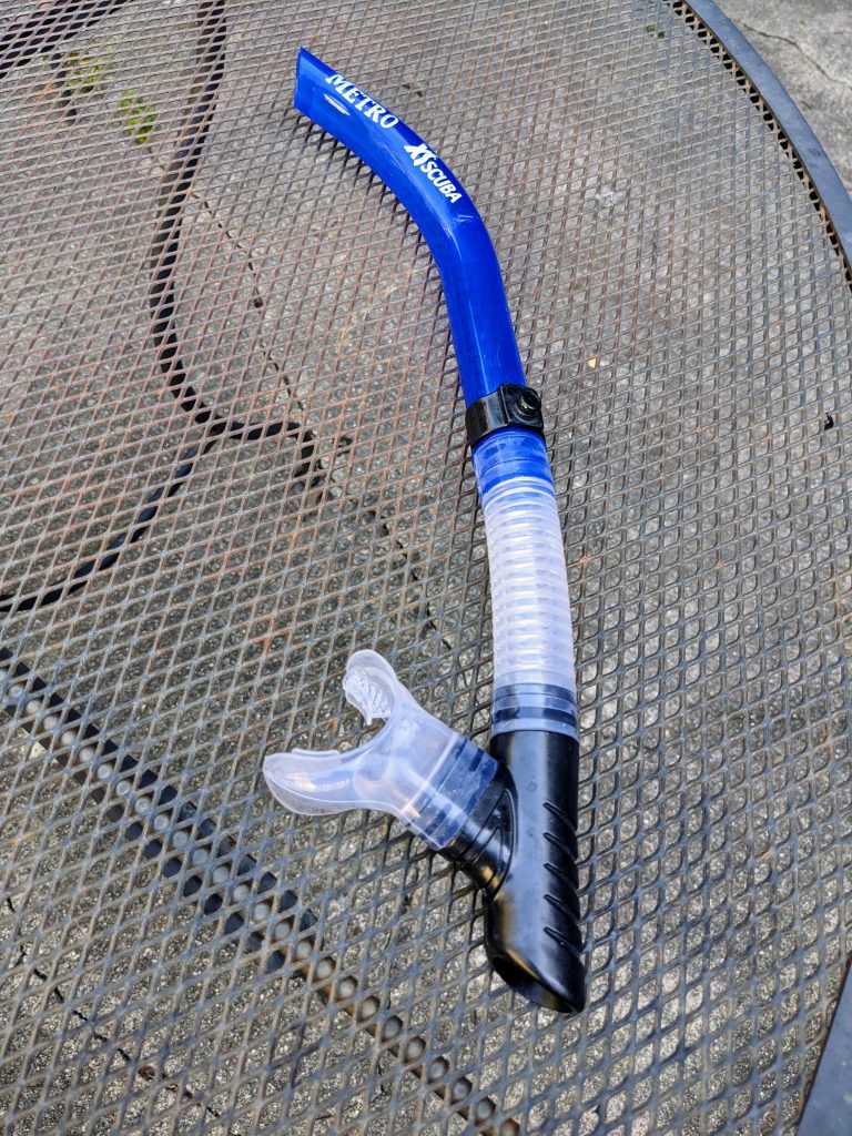 A simple blue colored snorkel with a clear mouthpiece.