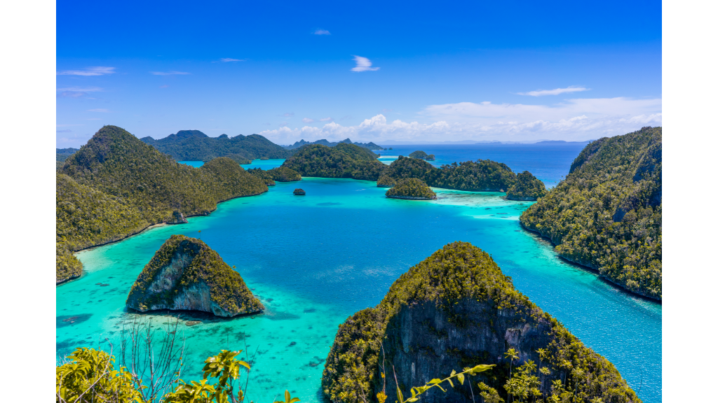 Raja Ampat islands scattered across turquoise water. 